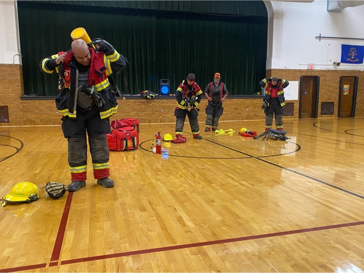 firemen racing to put on turnout gear